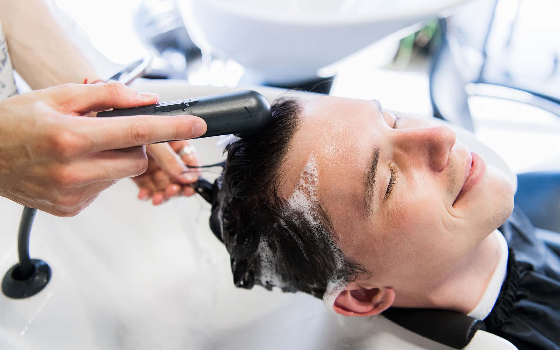 How should washing be done after hair transplantation?